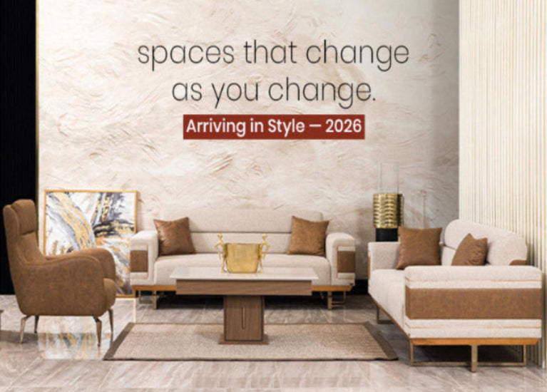 Modern living room with furniture and a marble wall with text about future arrivals.